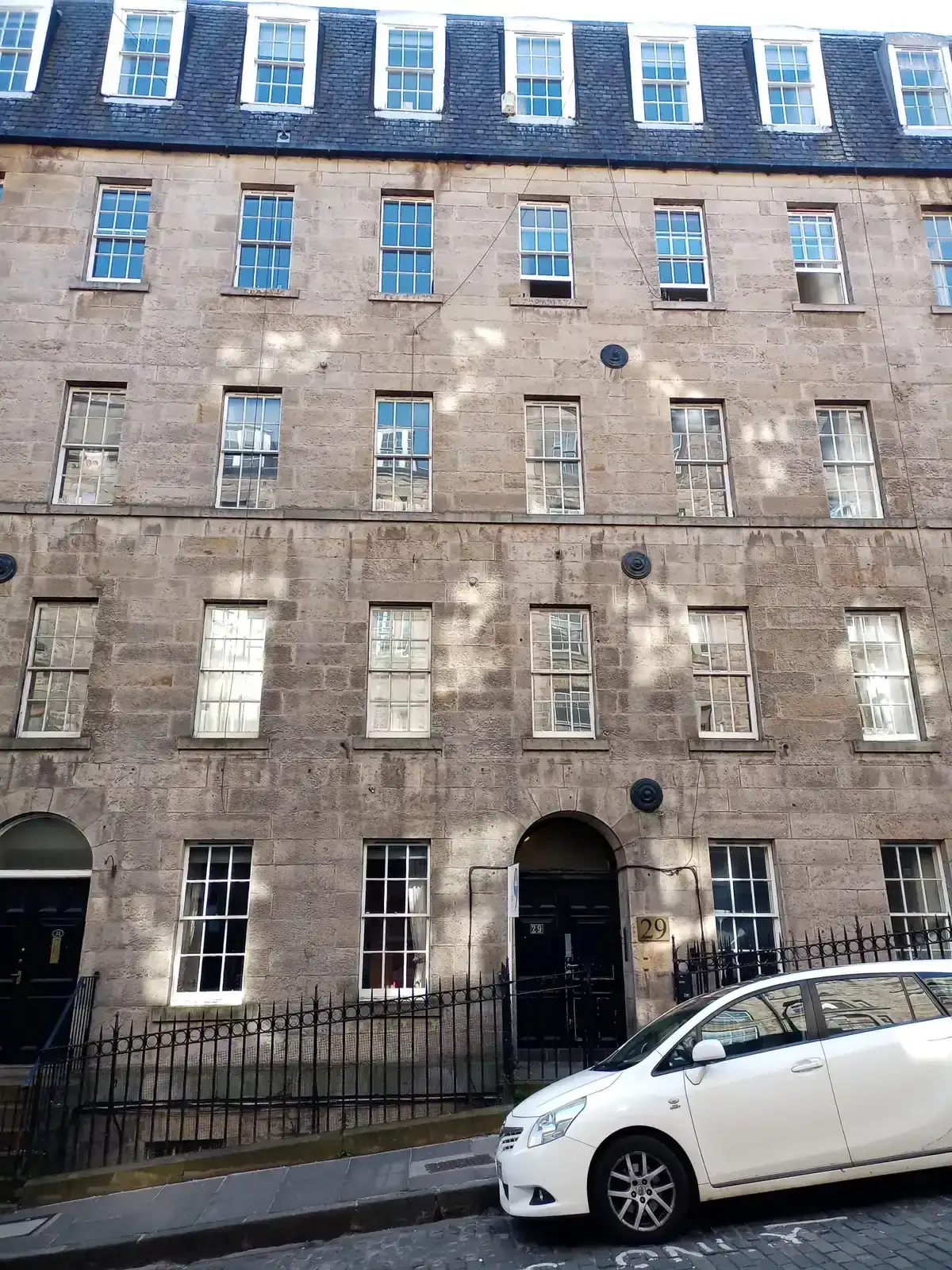 A Georgian stone frontage on Blair Street, the street whose arches hold the Blair Street Underground Vaults, Edinburgh ghost tours, Edinburgh, Scotland