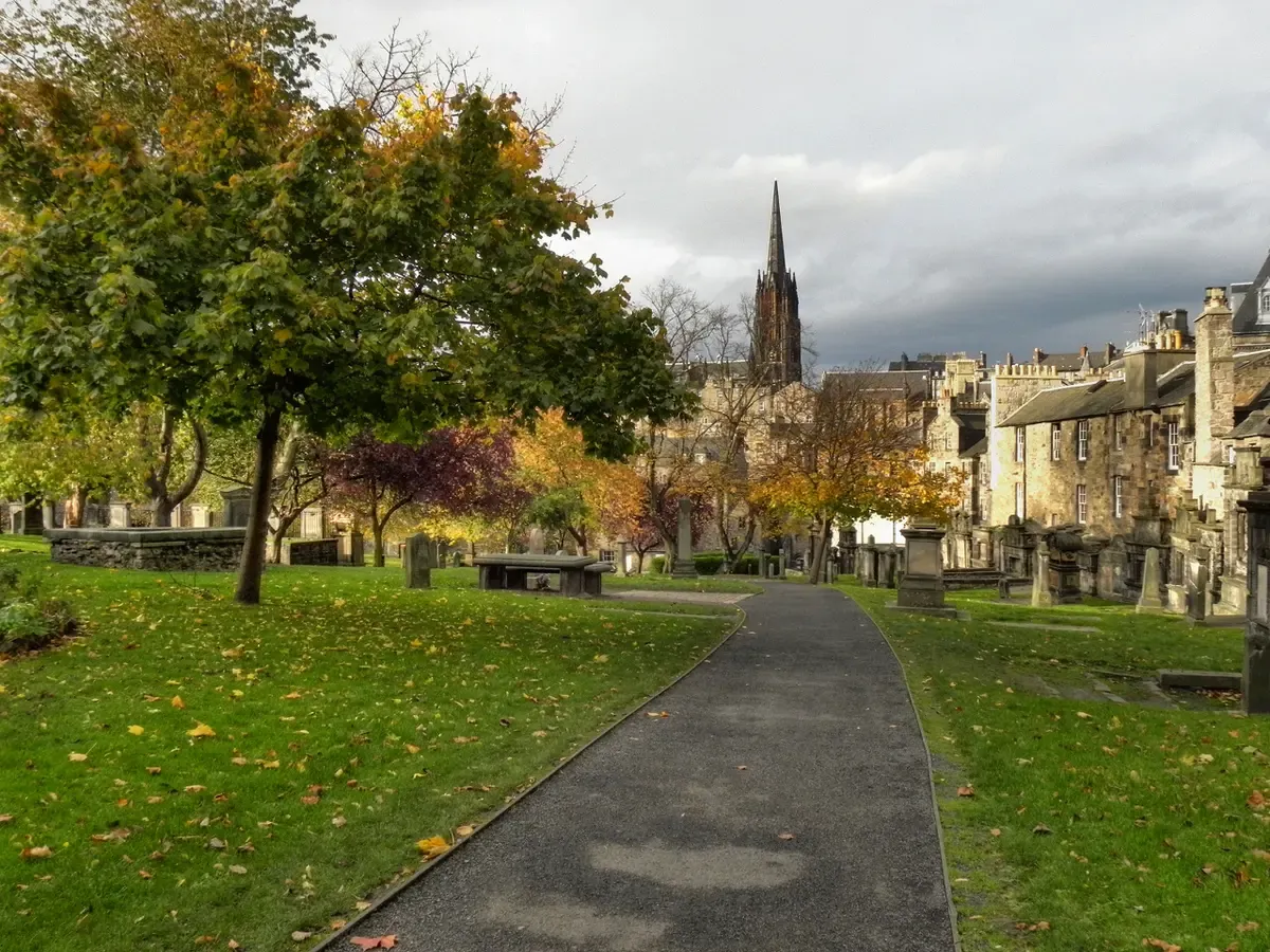 A path through Greyfriars Kirkyard in autumn, the graveyard visited on Edinburgh ghost tours, Scotland